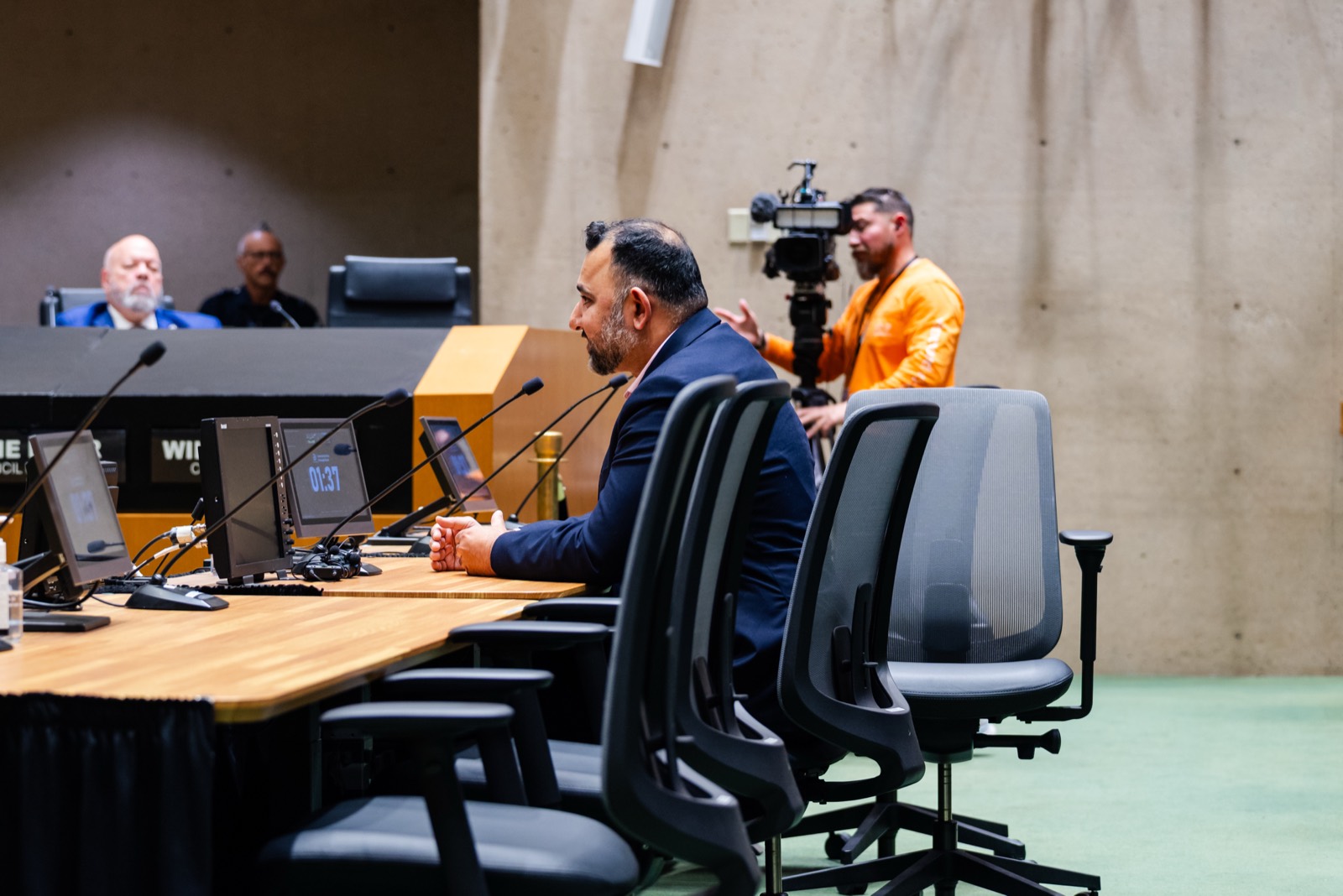 Zeeshan Hafeez speaking at a City of Dallas oversight board meeting